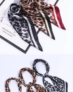 Detailed close-up view of classic leopard print silk-feel square scarves showing texture and folds.