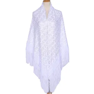 Detailed view of the white lace fringe shawl, featuring delicate hollow-out floral patterns.