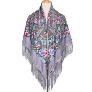 Detailed view of the grey traditional floral print shawl with elegant fringe and soft fabric.