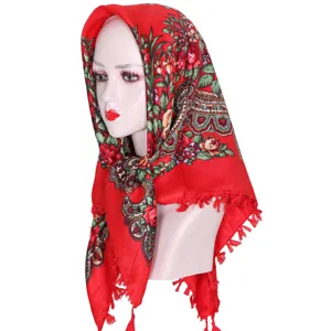 Detailed view of the red floral print square headscarf, traditional ethnic style cotton shawl.