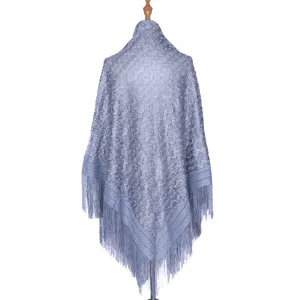 Blue hollow lace shawl for women, elegant floral pattern with fringe design and soft fabric.