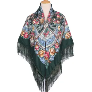 Detailed view of the dark green ethnic floral print square shawl with elegant fringe border.