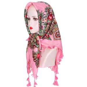 Pink floral print cotton head scarf close-up, traditional ethnic style tassel square shawl.