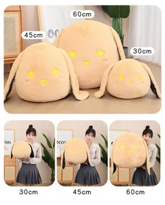 Détail de coussin en peluche lapin étoilé mignon, poupée en peluche douce pour lit et sommeil.