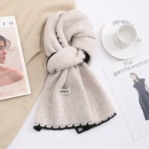 Cozy knit wool blend scarf with elegant contrast trim, stylish winter neck warmer for women.