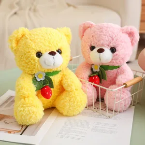 Cute sitting plush teddy bear toy with sweet strawberry pendant, soft stuffed doll for kids.