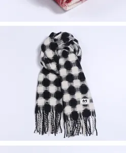 Black and white plaid winter scarf detail, soft imitation cashmere fabric with fringe edges.