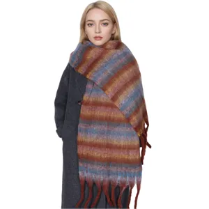 Cozy winter striped fuzzy scarf with fringe, warm long fashion accessory for women.
