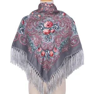 Vintage floral ethnic scarf detail, showcasing intricate paisley patterns and delicate fringe.