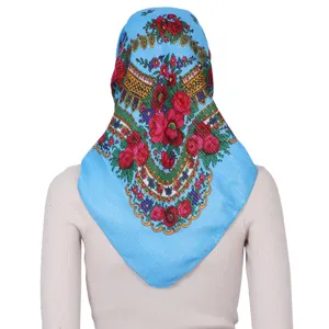 Back view detail of bright blue floral headscarf with gold threads, vintage ethnic style.