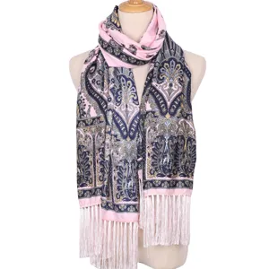 Detailed view of the pink ethnic paisley print scarf with elegant white fringe tassels.