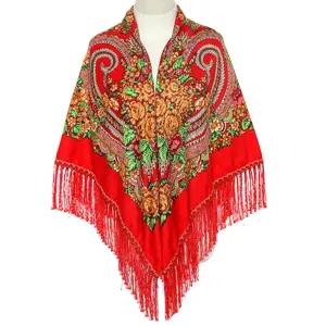 Detailed view of a red Russian ethnic floral fringe shawl scarf, retro winter square design.