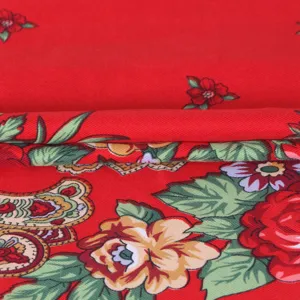 Red floral scarf detail showing traditional Chinese style peony and vintage pattern fabric.