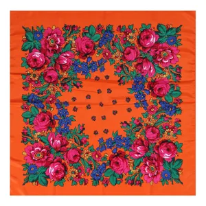 Detailed view of the vibrant orange traditional floral square scarf showing intricate rose and leaf print.