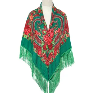 Green ethnic floral print shawl with delicate fringe trim, showcasing intricate retro details.