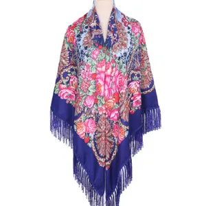 Detailed close-up view of vintage floral print blue shawl with elegant fringe and roses.