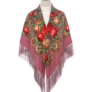 Detailed view of the Russian ethnic floral fringe scarf shawl, vintage rose pattern, warm cotton.