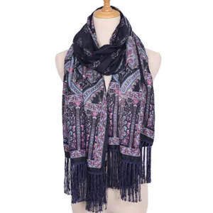 Detailed view of the dark blue ethnic paisley printed scarf featuring elegant fringe edges.