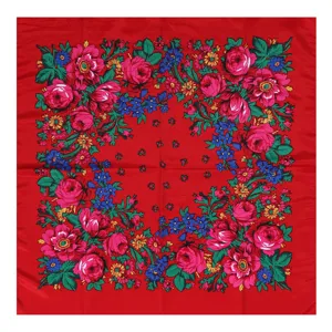 Detailed view of the Russian ethnic floral square scarf showing vibrant pink roses and red fabric.