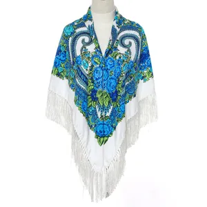 Detailed view of women's vintage floral paisley square shawl with elegant white fringe.