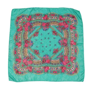 Exquisite metallic gold thread square scarf detail featuring vibrant green and red floral pattern.
