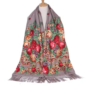 Retro floral print long scarf detail showing vibrant red roses and elegant fringe design.