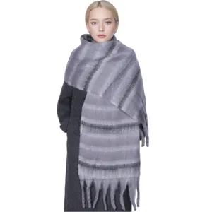 Grey striped winter scarf for women, cozy long knitted neck wrap with elegant fringe design.
