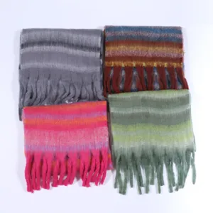 Detailed view of four colorful fuzzy striped scarves with fringe edges, warm winter fashion accessories.
