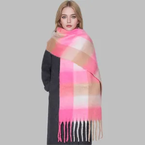 Close-up detail of the thick mohair colorful plaid scarf with fringes, warm winter accessory.