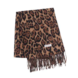 Detailed close up of women winter classic leopard print thick cashmere feel tassel scarf