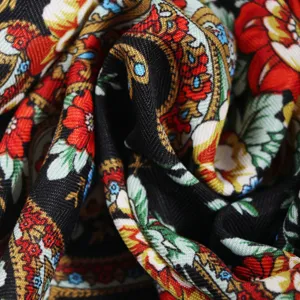 Close-up detail of Russian traditional floral printed scarf, showing rich ethnic textile texture.