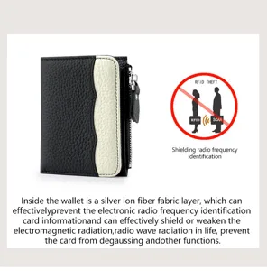 Portefeuille femme en cuir contrasté noir et blanc avec blocage RFID et poche zippée.