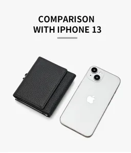 Black genuine leather trifold wallet detail shot showing compact size compared with phone.
