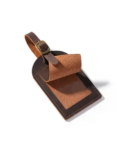 Vintage crazy horse leather luggage tag with clear ID window and metal buckle for travel bags.