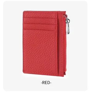 Detailed view of the red leather card holder featuring multiple slots and secure zipper pocket.