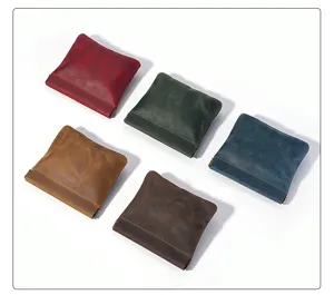 Detail shot of mini vintage crazy horse leather coin purse with metal spring clip closure in multi colors.