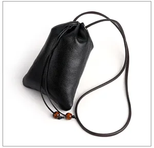 Black genuine leather drawstring phone pouch bag with strap detail and wooden beads.