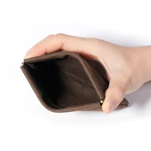 Retro genuine leather coin purse for men with metal spring frame, mini dark brown leather pouch.