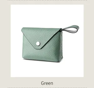 Green mini leather coin purse with envelope flap snap button and wrist strap daily use.