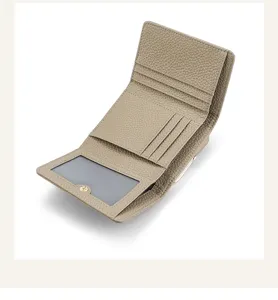 Genuine leather women short tri-fold wallet interior card slots metal clasp coin purse detail.