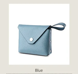 Blue mini leather coin purse with envelope flap and snap button closure for daily use.