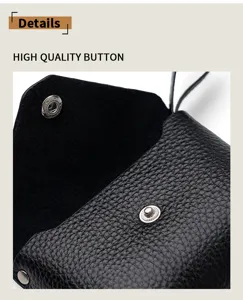 Genuine leather mini coin purse detail shot, black snap button pouch with textured cowhide.