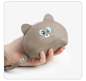 Genuine leather coin purse with cute cat ear design, compact size, grey zipper pouch.