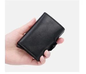 Detail shot of black PU leather automatic pop-up card holder wallet, compact pocket size.