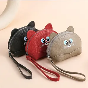 Detail view of cute cat shaped genuine leather coin purse with wrist strap in various colors.