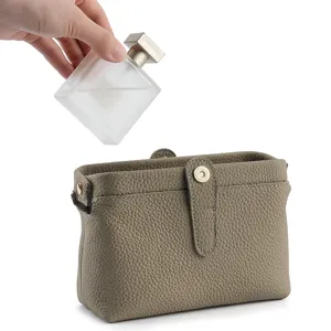 Genuine leather cosmetic bag for women, stylish kiss-lock clutch and toiletry organizer.