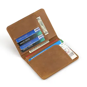 Vintage brown leather passport holder and travel wallet with multiple card slots and cash pocket.