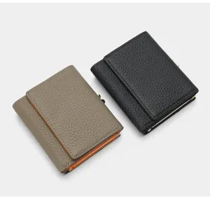 Genuine leather trifold wallet for women with multi card slots and contrast color edges.