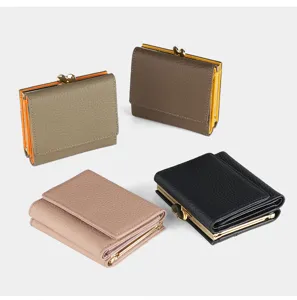 Detail view of genuine leather women trifold wallet featuring chic kiss lock and card slots.