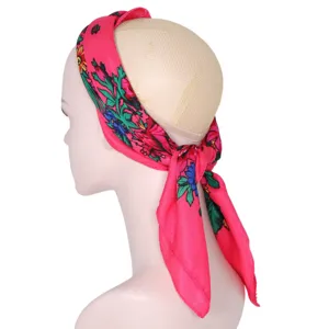 Detailed view of the pink floral square headscarf, ethnic style cotton fabric side display.